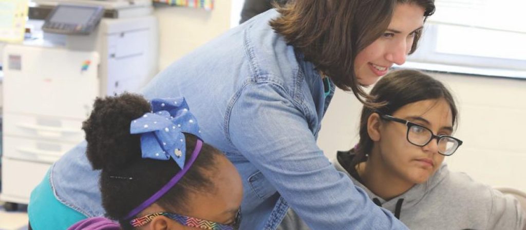 Duke Marine Lab volunteers working with children