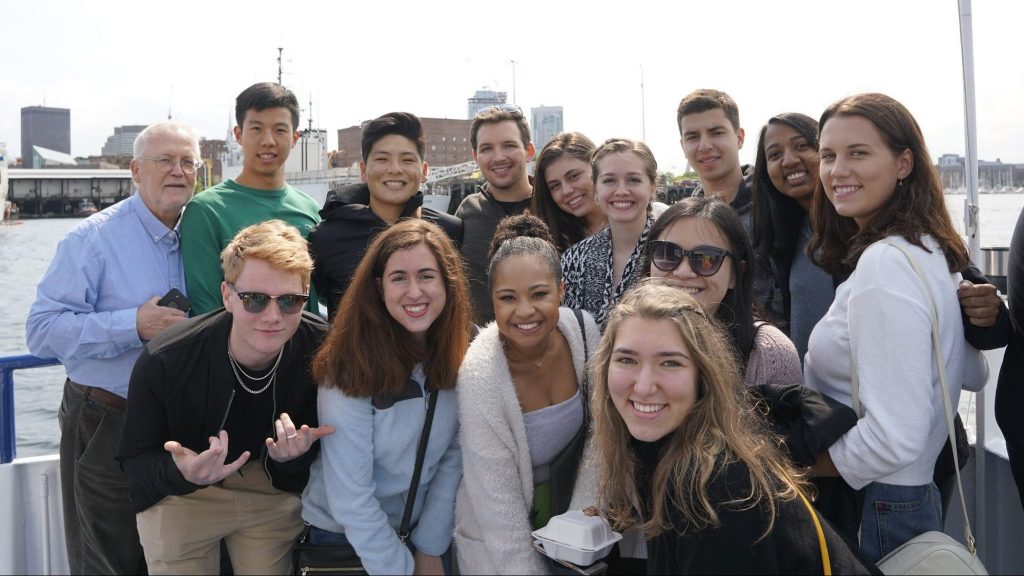 DukeEngage students posing on a boat