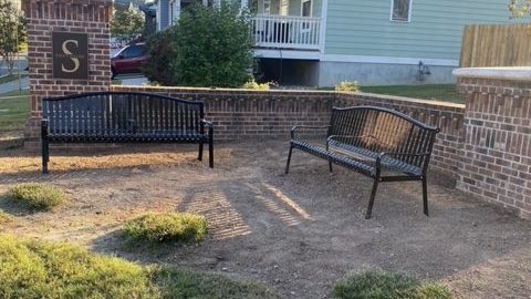 garden and benches near homes